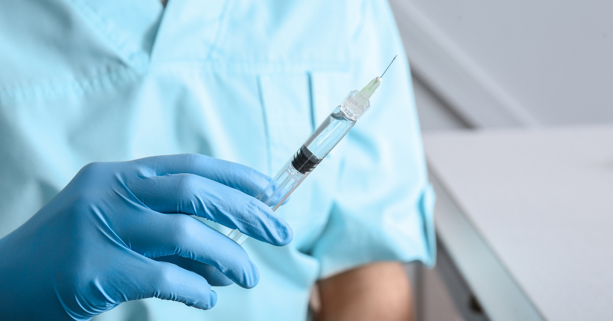 image of a provider holding a syringe of Botox