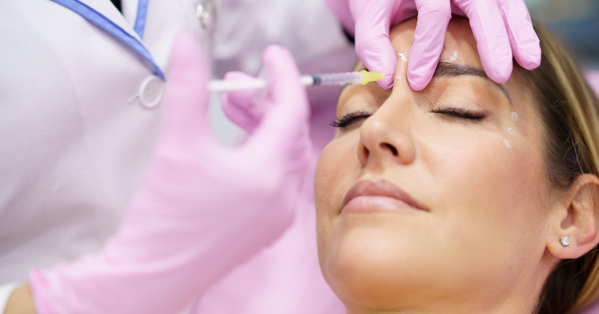 woman getting Botox in the upper part of the nose