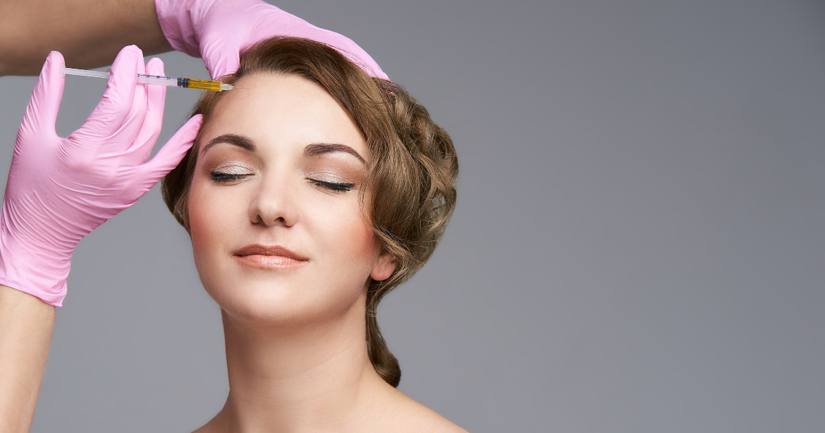 woman getting botox in the temporal areas